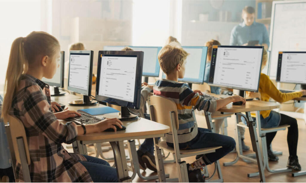 Students in a classroom taking an exam on Exam.net